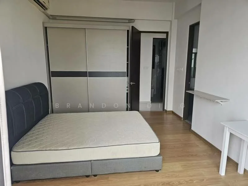 Bedroom features: queen-size bed frame without mattress, built-in wardrobe with sliding doors, light wood laminate flooring, white painted walls, window with natural light, small study table, wall-mounted air conditioning unit; style: modern.