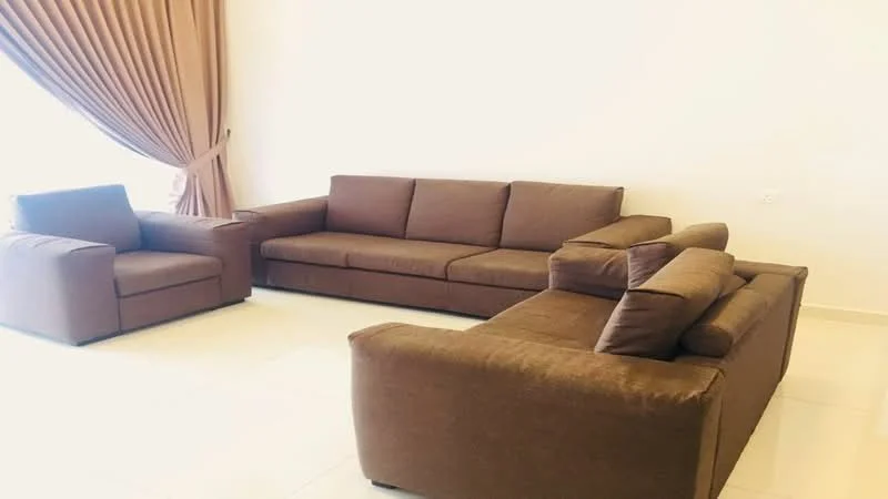 Living features: 3-seater fabric sofa in brown, 2-seater fabric sofa in brown, armchair in brown, floor-to-ceiling windows, curtains in beige, white painted walls, tile flooring, natural light from window; style: modern.
