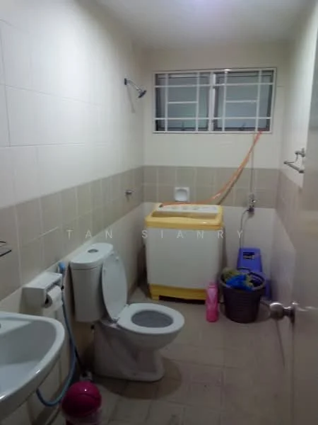 Bathroom features: white tiled walls, light beige tiled flooring, single-sink vanity, toilet, shower with wall-mounted faucet, window with grid pattern, washing machine, plastic laundry basket, pink storage container.