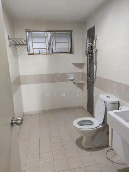 Bathroom features: white tiled walls, light beige tiled flooring, single-sink vanity with white cabinet, one-piece toilet, shower with handheld showerhead, window with metal grilles, shelf above toilet, wall-mounted mirror.