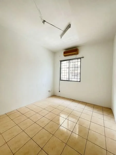 Room features: white painted walls, tile flooring, 1 wall-mounted split AC, single window with metal grille, ceiling light fixture, no visible furniture.