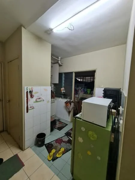 Kitchen features: white painted walls, tile flooring, green refrigerator, white microwave, sink, kitchen cabinets, countertop, floor mat, wall-mounted pipe, window, door, decorative wall stickers.