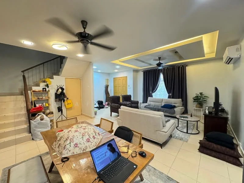 Living features: 5-blade ceiling fan with light, recessed downlights, sofa in light grey fabric, 2-seater sofa, coffee table, TV console, wall-mounted TV, area rug, decorative plant, curtains in dark grey, ceiling with tray design, tiles flooring in light colour; style: modern. Room features: wooden staircase, dining table with laptop, stack of cushions.