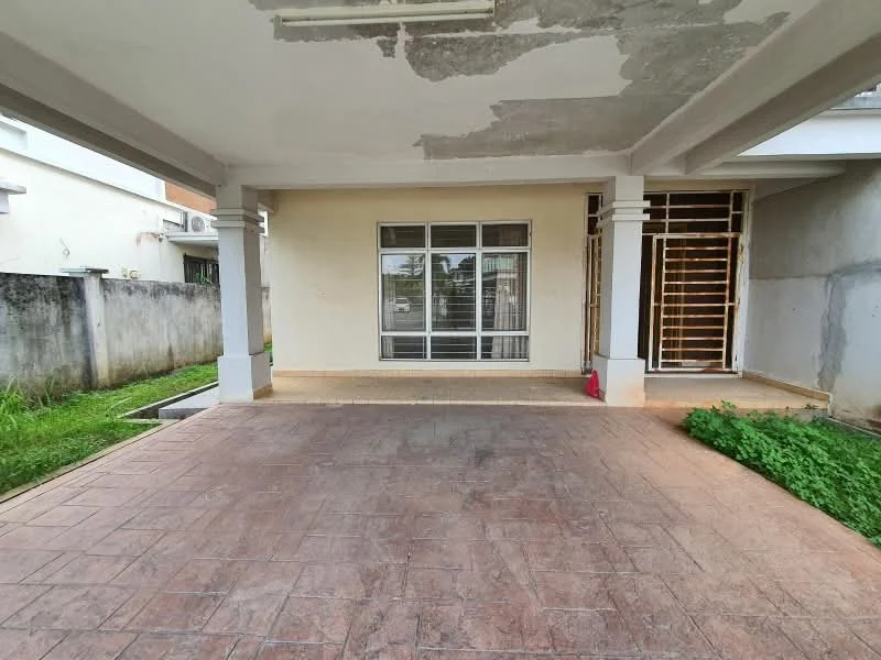Exterior features: concrete flooring, covered porch area, large window with grid design, exposed wall with peeling paint, surrounding grass area, fenced perimeter, adjacent wall with no visible cladding.