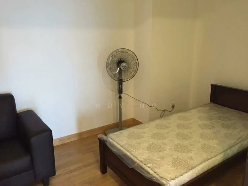 Bedroom features: single bed, mattress with patterned cover, wooden bed frame, floor fan, light wood flooring, white painted walls, black fabric sofa.