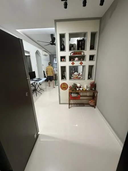 Room features: white tiled flooring, grey painted walls, recessed ceiling lights, ceiling fan, decorative wall shelves, mirror with decorative frame, small decorative table, wall-mounted artwork, open space leading to another room; style: modern.