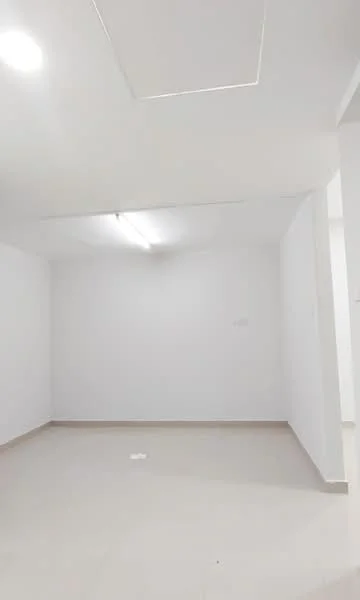 Room features: white painted walls, plain ceiling, fluorescent lighting, light-colored tile flooring.