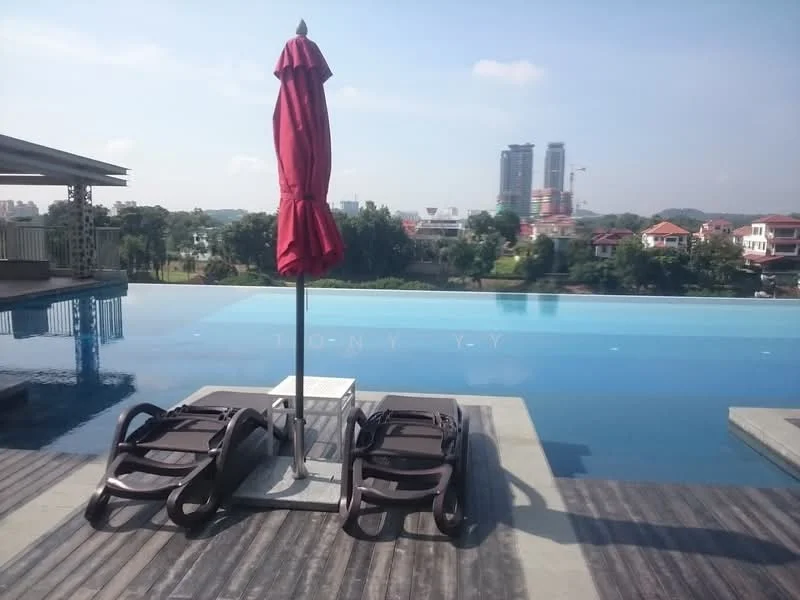 Exterior type: swimming pool deck; features: infinity pool, pool deck with loungers, red umbrella, wooden decking, city skyline in background, surrounded by greenery; style: modern.