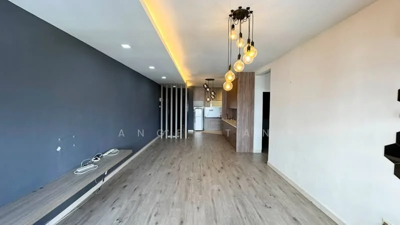 Living features: wooden flooring, grey accent wall, white painted walls, recessed downlights, pendant light with multiple bulbs, built-in shelving unit, open layout, kitchen visible in background; style: modern.