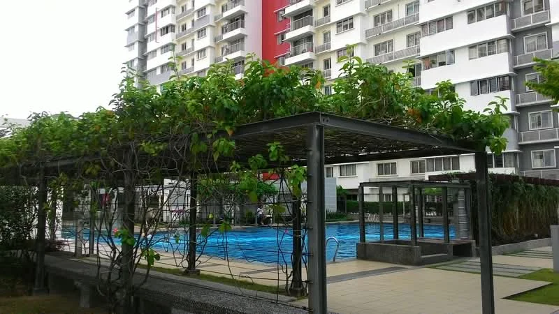 Exterior type: high-rise condominium; features: swimming pool, pool deck with loungers, landscaped garden with trellis, manicured lawn, concrete pathway, glass enclosure around pool area, multiple storey building, greenery along the trellis; style: modern.
