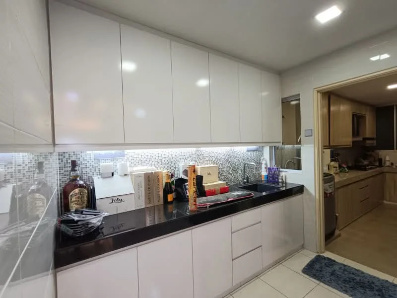 Kitchen features: white high-gloss cabinetry, black granite countertop, mosaic tile backsplash, stainless-steel sink, chrome pull-down faucet, built-in oven, freestanding range oven, recessed LED downlights, tile flooring, decorative items on countertop, wine bottles, kitchen utensils, dish rack; style: modern.
