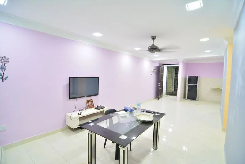 Living features: purple painted walls, white ceiling with recessed lighting, ceiling fan, large flat-screen TV on wall, dining table with four chairs, tile flooring, sliding glass door, fridge, water bottle on table, decorative wall art, open layout; style: modern.