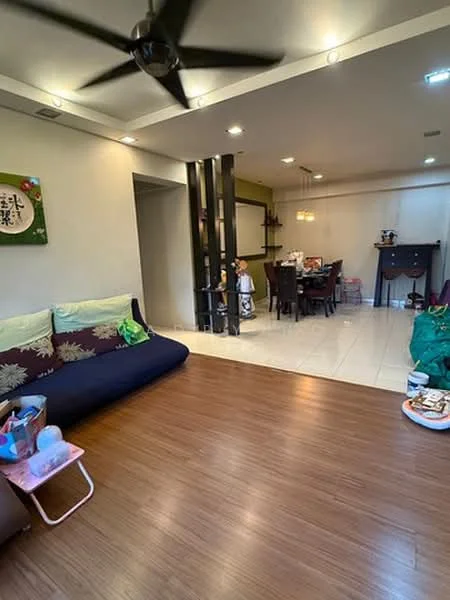 Living features: 5-blade ceiling fan with light, brown laminate flooring, green accent cushions, sofa with floral pattern, decorative wall art, recessed lighting, open layout to dining area; style: modern. Dining features: dining table with chairs, wall-mounted shelf, pendant lighting, white walls, tile flooring; style: modern.