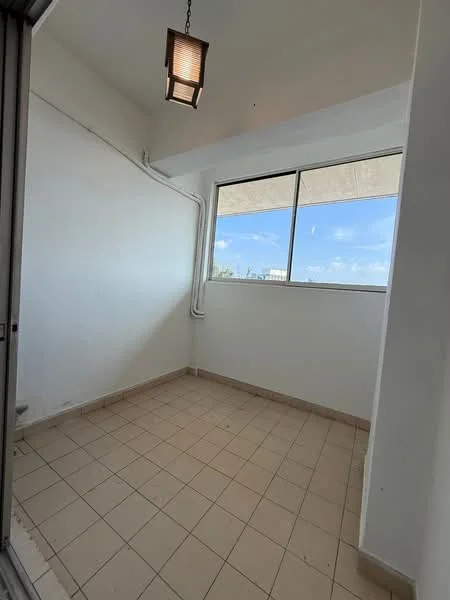 Room features: white painted walls, tile flooring, large windows, ceiling light fixture, corner room, natural light, no visible furniture, neutral color scheme.