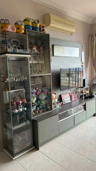 Living features: light-colored walls, ceramic tile flooring, wall-mounted TV, glass display cabinet, grey TV console with drawers, decorative figurines on display, air conditioning unit, curtains, ceiling fan, decorative wall art; style: modern.