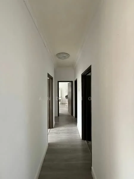 Hallway features: white painted walls, grey laminate flooring, crown moulding, recessed ceiling light, door frames in dark wood, two doorways leading to rooms; style: modern.