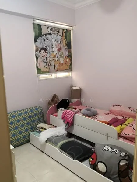 Bedroom features: light purple painted walls, white ceiling, two single beds with colorful bedding, cartoon-themed beddings, window with roller blinds featuring animal print, lampshade on bedside table, flooring with light-colored tiles, decorative throw pillows, blue patterned accent chair, stuffed toys on beds; style: child-friendly.