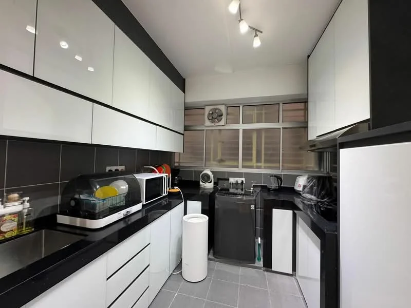 Kitchen features: black granite countertop, white high-gloss cabinetry, stainless-steel sink, chrome faucet, built-in microwave, black refrigerator, toaster, dishwasher, grey tile flooring, under-cabinet lighting, window with blinds, kitchen exhaust hood, open shelving, circular ceiling light; style: modern.