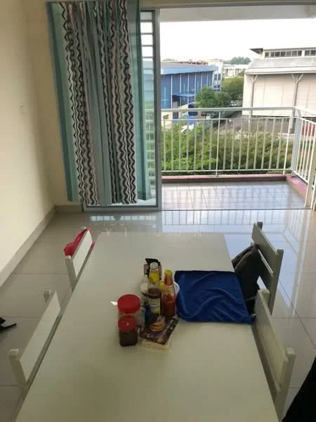 Dining features: white dining table, 4 white chairs, ceramic tile flooring, light-colored walls, curtains with geometric pattern, bottles and condiments on the table, blue tablecloth, sliding glass door leading to balcony; style: modern; view: garden. Room features: sliding glass door, balcony railing, outdoor view.