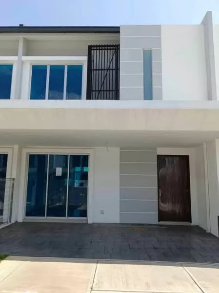 Exterior type: linked terrace house; features: white painted facade, glass windows, horizontal grey paneling, single wooden door, concrete flooring, manicured lawn, balcony with railing, modern architectural design; style: modern.