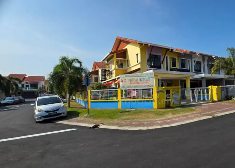 Exterior type: linked terrace house; features: two-storey building, yellow and cream painted facade, red tiled roof, balconies on upper floor, manicured lawn, paved walkway, fenced yard, surrounded by palm trees, street parking available, clear blue sky; style: modern.