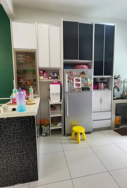 Kitchen features: white cabinetry, black cabinetry, stainless-steel fridge, countertop with black pattern, open shelving, storage cabinet, yellow stool, tile flooring, green accent wall, various kitchen appliances, decorative items on shelves, plastic containers; style: modern.