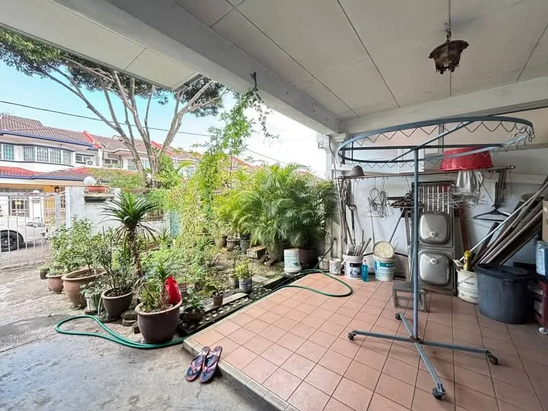 Room features: tiled flooring, hanging clothes rack, potted plants, garden hose, outdoor light fixture, exposed ceiling, concrete walls, sliding door access, outdoor space with greenery; view: garden.