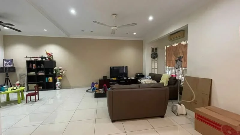 Living features: cream painted walls, white ceiling, recessed downlights, 5-blade ceiling fan, large windows with sheer curtains, brown leather sofa, coffee table, TV console, wall-mounted TV, black shelving unit, decorative vase with flowers, colorful children's table, tile flooring, vacuum cleaner, cardboard boxes; style: modern.