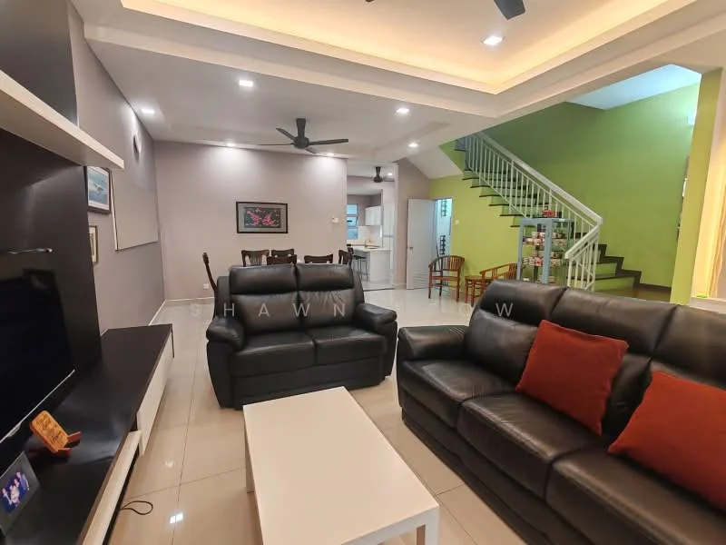Living features: black leather 3-seater sofa, black leather 2-seater sofa, orange decorative cushions, white coffee table, wall-mounted TV, light grey painted walls, recessed ceiling lights, ceiling fan, glossy tile flooring, open layout to dining area, decorative artwork on wall; style: modern. Dining features: wooden dining table, 4 wooden dining chairs, light grey painted walls, open layout to living area; style: modern. Room features: green accent wall, staircase leading to upper floor, kitchen area visible in background.