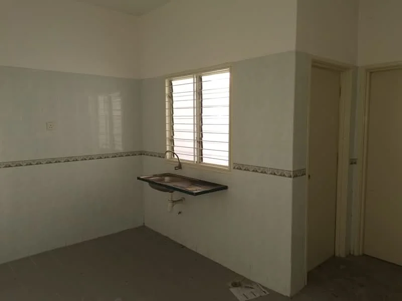 Room features: white painted walls, light grey tiled flooring, single-bowl stainless-steel sink, chrome faucet, window with horizontal slats, door to adjacent room, decorative tile border, empty space; style: minimalist.