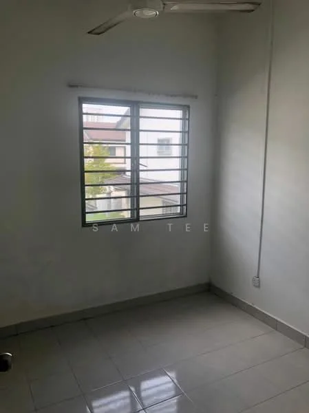 Room features: white painted walls, tile flooring, sliding window with metal grille, ceiling fan, single electrical outlet, corner of room with no visible furniture.