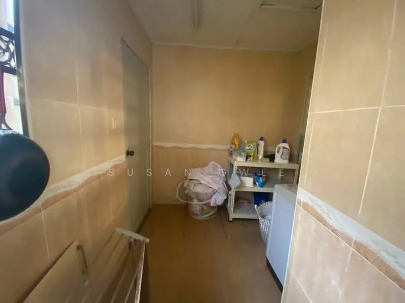 Laundry features: cream tiled walls, brown tiled flooring, white cabinetry, laundry basket, cleaning supplies on shelf, sink, window for natural light, light fixture on ceiling.