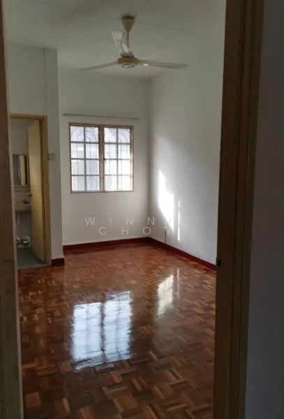 Room features: wooden flooring, white painted walls, ceiling fan, window with multiple panes, natural light from window, red trim at the base of the walls, high ceiling, no visible furniture; style: minimalist.
