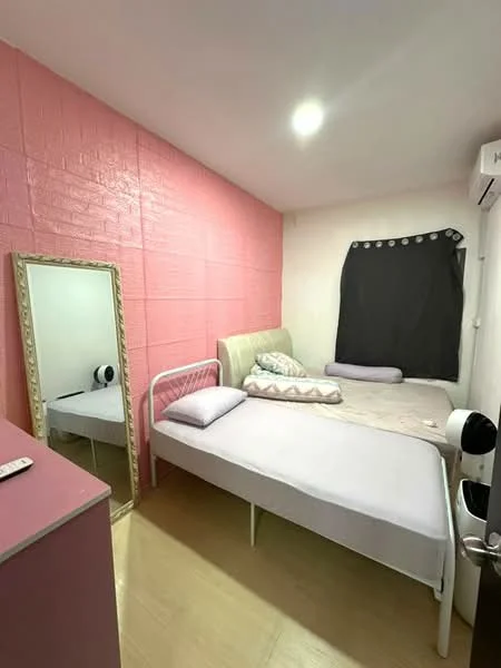 Bedroom features: pink accent wall, white painted walls, laminate flooring, two single beds, upholstered headboard, mirror, blackout curtains, wall-mounted air conditioning unit, nightstand, decorative pillows; style: modern.