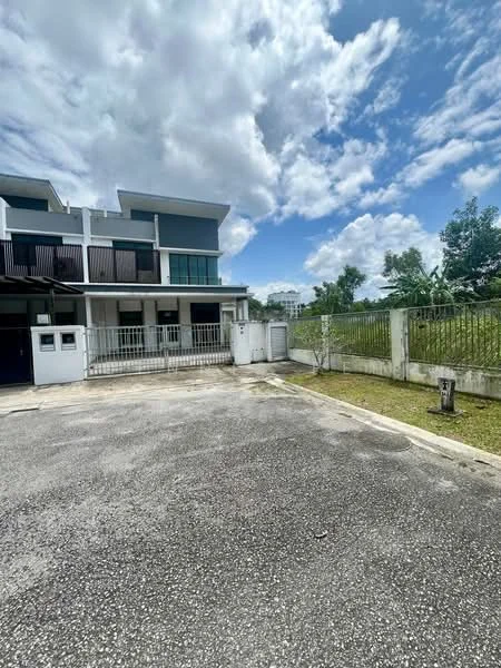 Exterior type: semi-detached house; features: white painted facade, glass windows, manicured lawn, fenced yard, paved driveway, two gates, two-storey structure, balconies on upper level, surrounded by greenery, cloudy sky; style: modern.
