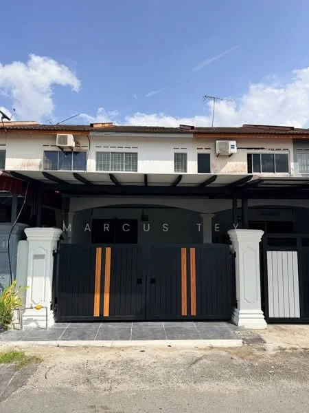 Exterior type: linked terrace house; features: black and orange wooden gate, white painted facade, flat roof with overhang, two air conditioning units visible, columns at entrance, grey tiled walkway, front porch area, windows with white frames; style: modern.