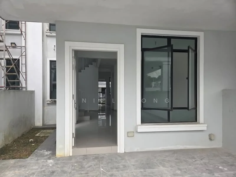 Exterior features: grey painted facade, large window with black frame, porch area with tiled flooring, exposed concrete wall, surrounding unfinished landscaping, staircase visible through the doorway; style: modern.