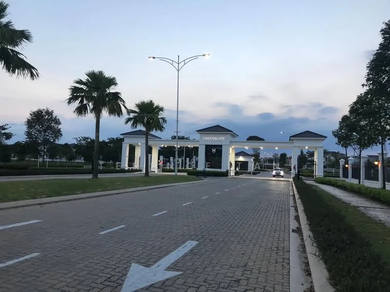Exterior type: main entrance gate; features: paved driveway, white painted facade, columns at entrance, landscaped greenery, palm trees, street lighting, gated entry, signage with 'Green Gate', manicured lawn, surrounding trees; style: modern.