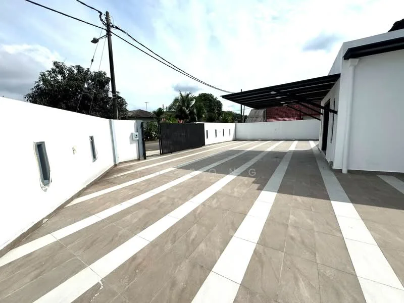Exterior features: paved driveway, white painted walls, grey tile flooring, metal roof awning, fenced perimeter, landscaped greenery, utility poles visible, outdoor lighting fixtures; style: modern.
