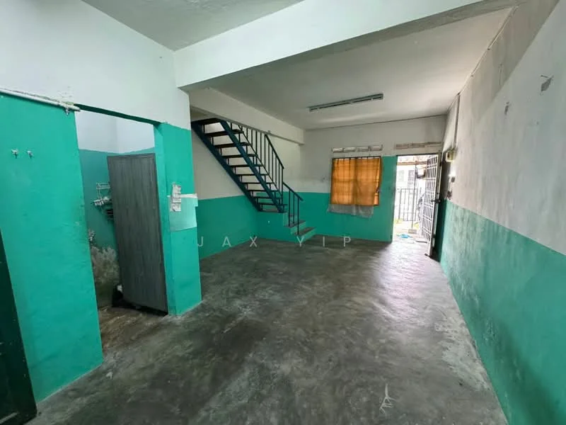 Room features: green and white painted walls, concrete flooring, staircase with metal railing, window with curtain, door leading outside, exposed ceiling, light fixture on ceiling, open layout; style: minimalist.