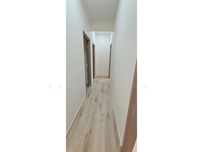 Hallway features: light wood laminate flooring, white painted walls, plain ceiling, door frames in light wood, two doors visible on the left, one door visible on the right, narrow hallway layout, no visible lighting fixtures; style: modern.