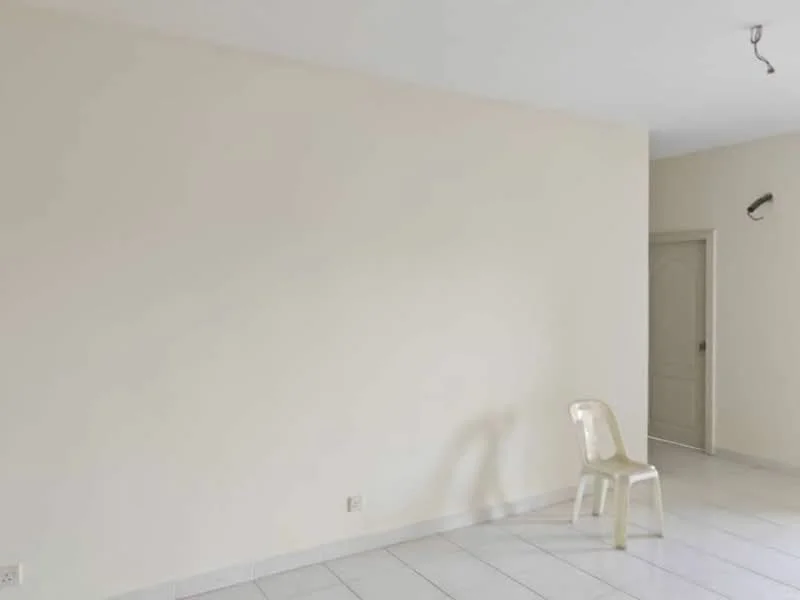 Room features: white painted walls, white tiled flooring, single plastic chair, doorway visible, light fixture on ceiling; style: minimalist.