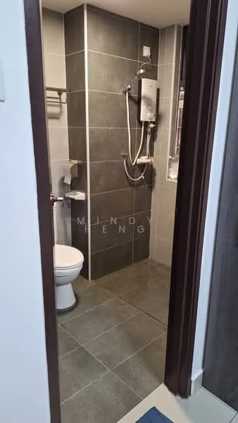 Bathroom features: grey tile flooring, grey wall tiles, white toilet, shower area with glass partition, wall-mounted shower head, water heater, towel rack, toilet paper holder, small window for ventilation; style: modern.