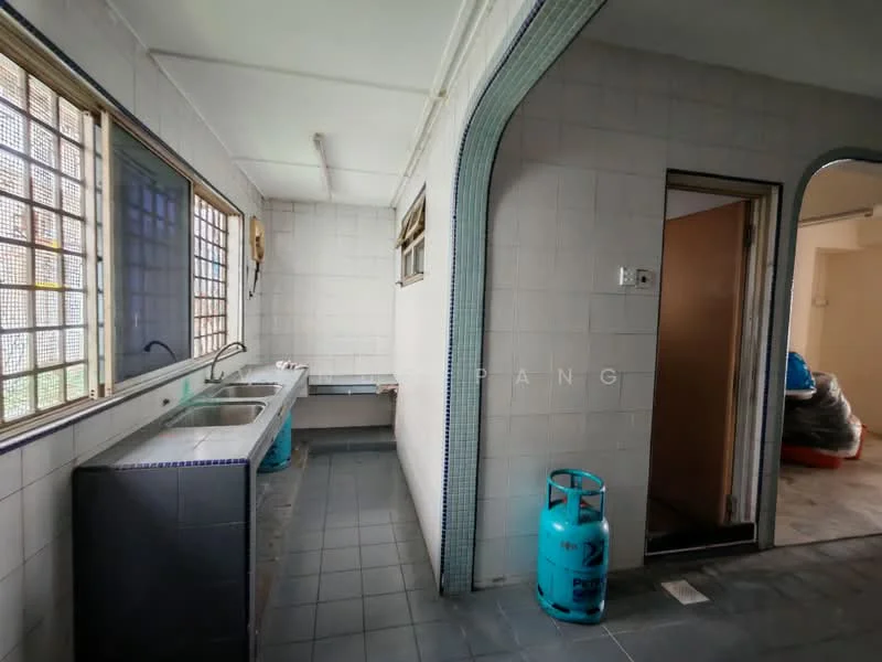 Laundry features: double-bowl stainless-steel sink, chrome faucet, grey tiled flooring, white tiled walls, large windows for natural light, gas cylinder, doorway leading to another room, counter space, exposed plumbing.