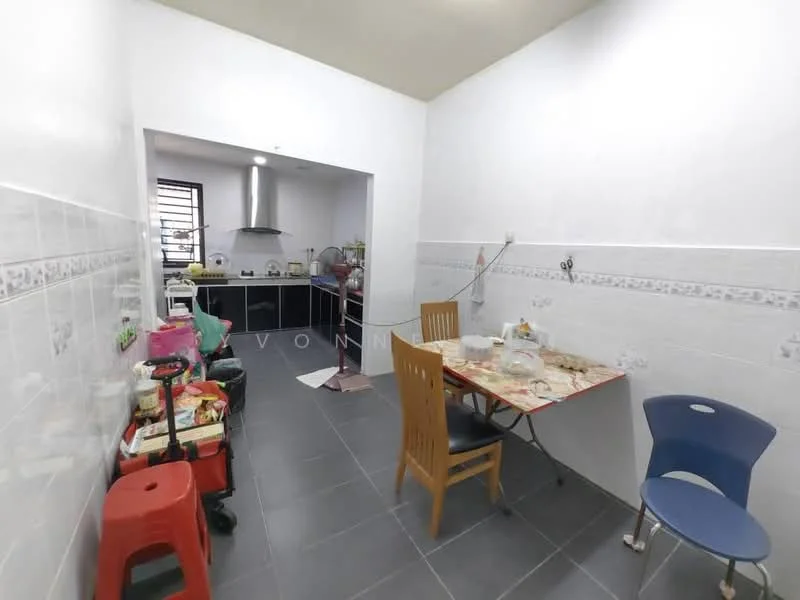 Kitchen features: white painted walls, grey tiled flooring, kitchen cabinets, stainless-steel sink, exhaust hood, built-in stove, dining table with chairs, plastic storage cart, wall-mounted electrical outlets, window with natural light.