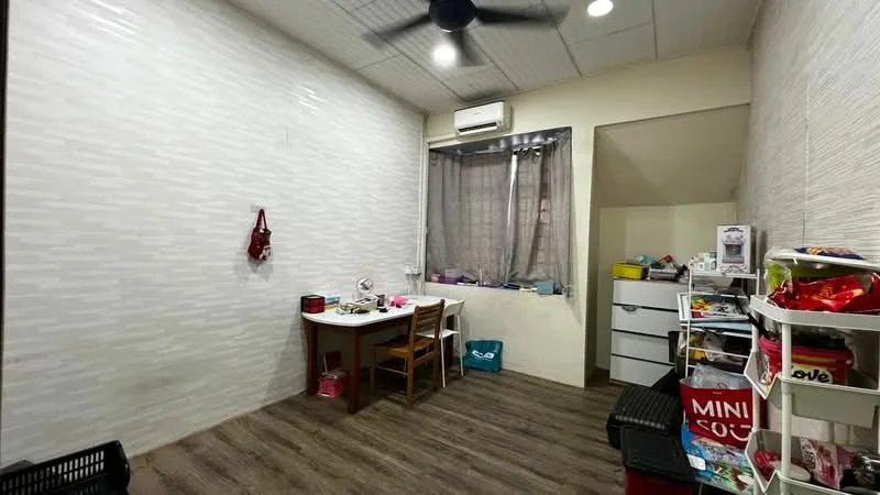 Room features: light wood laminate flooring, white painted walls, ceiling fan, window with sheer curtains, desk with chair, dresser with drawers, storage shelves, decorative items on shelves.