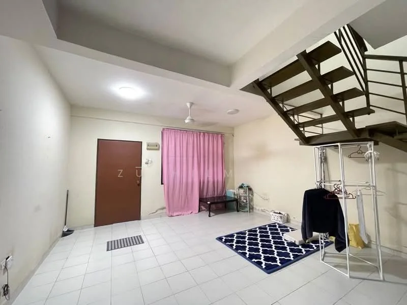 Room features: white painted walls, tile flooring, ceiling fan, window with sheer curtains, pink curtain, metal staircase, door with brown finish, area rug with geometric pattern, clothes rack, small coffee table; style: minimalist.
