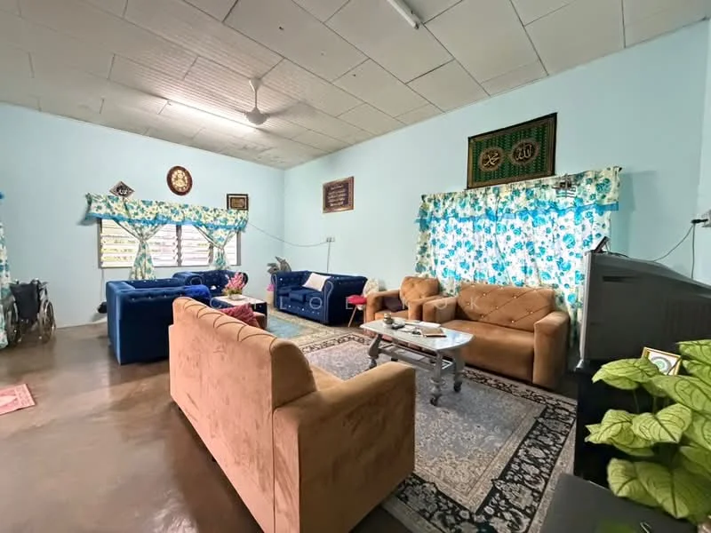 Living features: light blue painted walls, polished concrete flooring, ceiling fan, 3-seater fabric sofa in blue, 2-seater fabric sofa in beige, coffee table, area rug with intricate pattern, curtains with floral pattern, wall-mounted decorative items, potted plant; style: traditional.