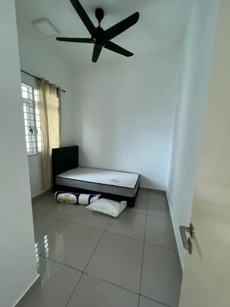 Bedroom features: single bed frame without mattress, grey tiled flooring, white painted walls, ceiling fan, window with sheer curtains, light from window, decorative pillows on floor; style: minimalist.