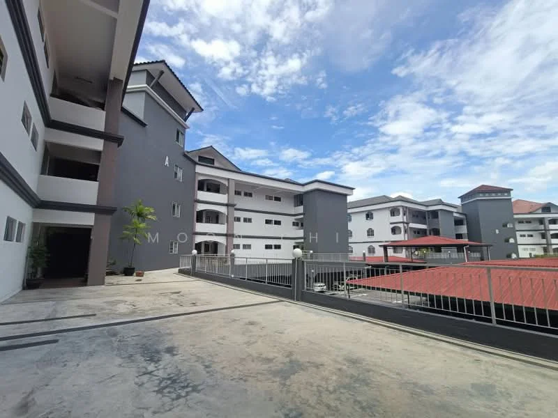 Exterior type: low-rise apartment block; features: grey painted facade, white painted facade, flat roof, approximately 3-storey, manicured lawn, parking deck, surrounded by mature greenery; style: modern.